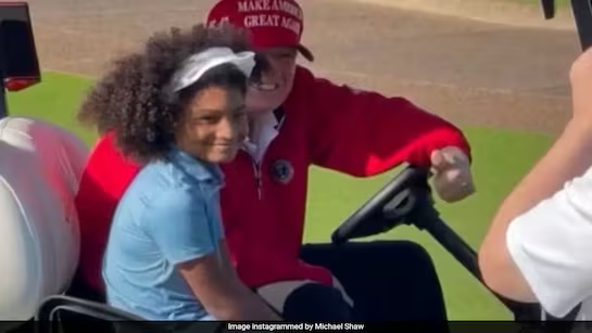 trump with young golfer with beautiful hair