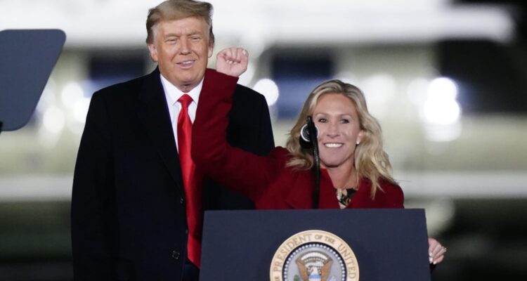 marjorie taylor greene with fist up and trump
